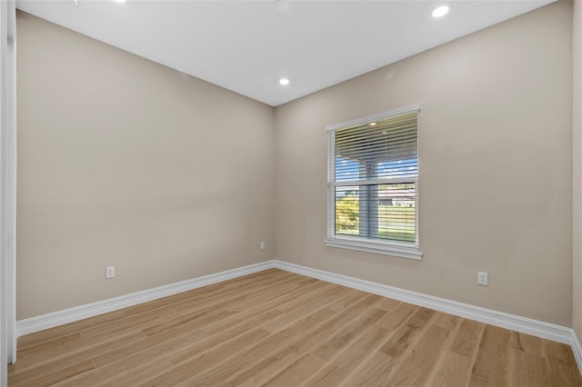 spare room featuring light wood-type flooring