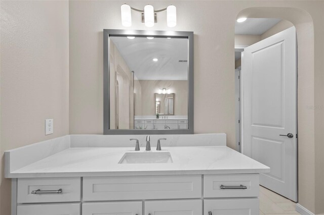 bathroom featuring vanity and tile patterned flooring