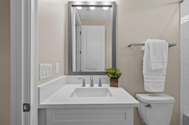 bathroom with vanity and toilet