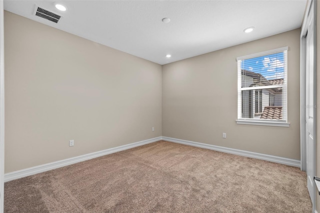 empty room featuring carpet flooring