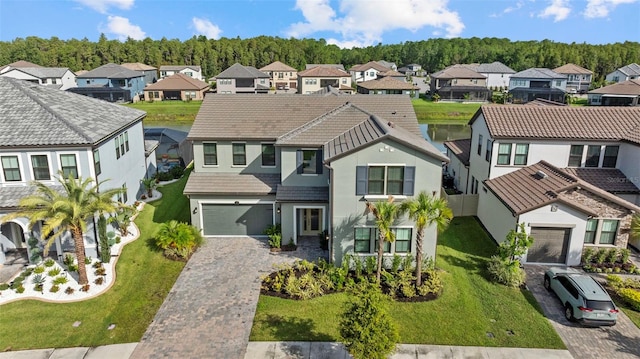 view of front facade with a front yard and a garage