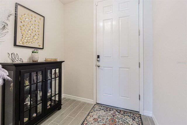 entryway with light hardwood / wood-style floors