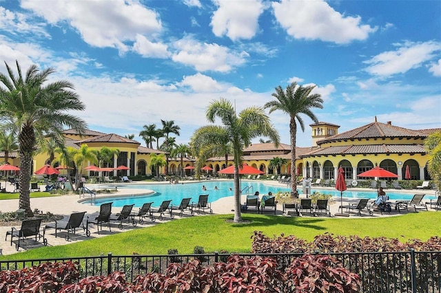 view of pool featuring a yard and a patio area