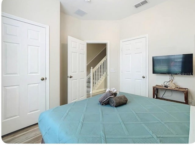 bedroom with light hardwood / wood-style floors