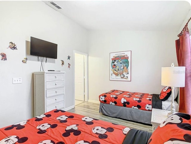 bedroom with wood-type flooring