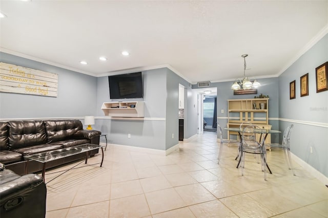 living room featuring ornamental molding and light tile patterned flooring