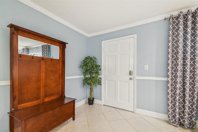 entryway with light tile patterned floors and ornamental molding