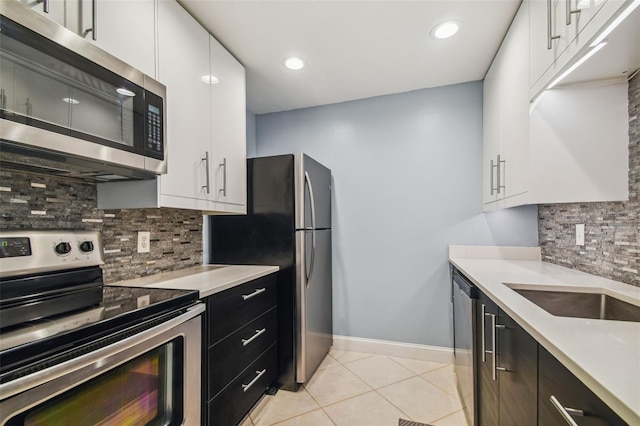 kitchen featuring white cabinetry, tasteful backsplash, and appliances with stainless steel finishes