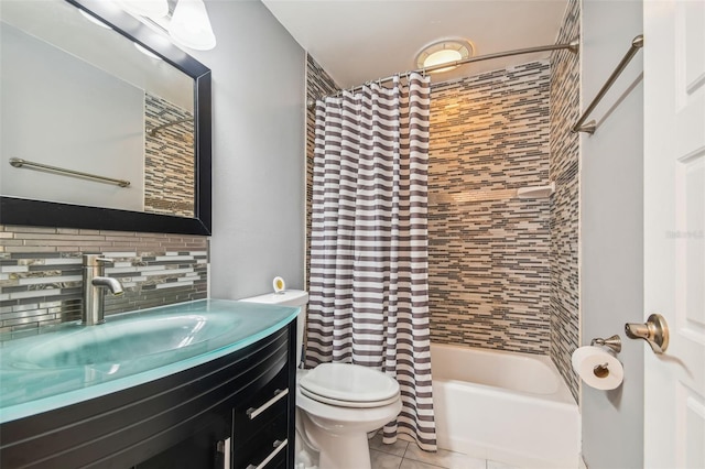 full bathroom featuring toilet, tasteful backsplash, shower / tub combo, vanity, and tile patterned flooring