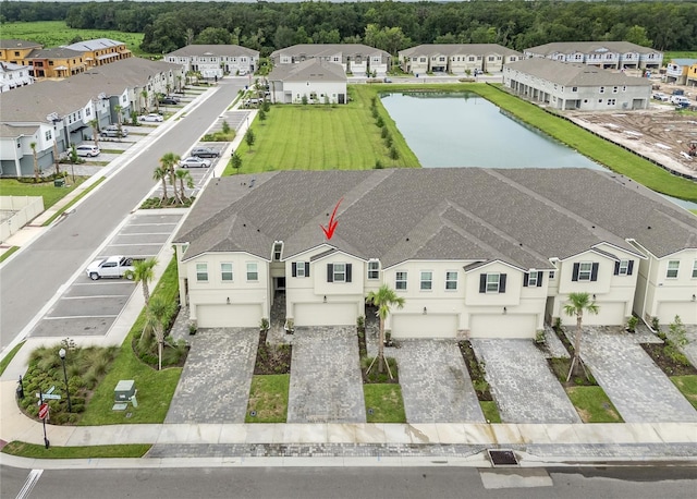 drone / aerial view with a water view