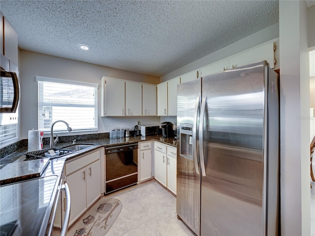 kitchen featuring white cabinets, dark stone countertops, stainless steel fridge with ice dispenser, and black dishwasher