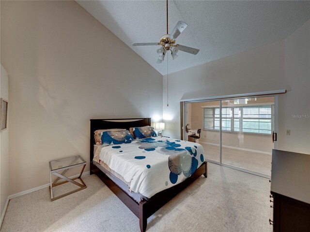 bedroom featuring carpet flooring, a textured ceiling, ceiling fan, high vaulted ceiling, and a closet