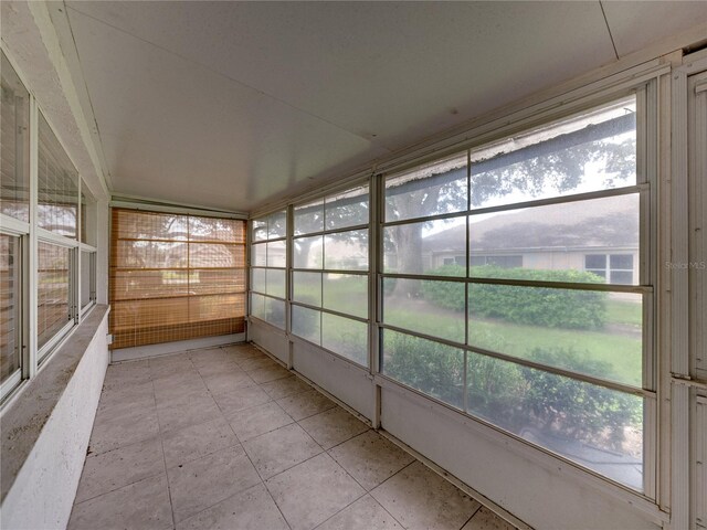 unfurnished sunroom with plenty of natural light