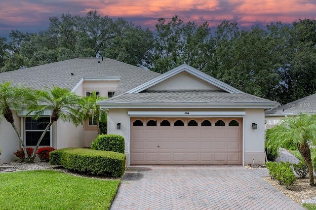 view of front of property with a garage