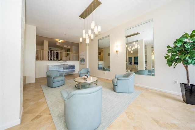 tiled living room featuring an inviting chandelier