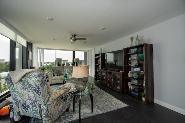 tiled living room featuring expansive windows, a healthy amount of sunlight, and ceiling fan