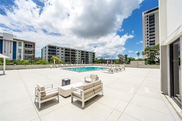 view of swimming pool with a patio