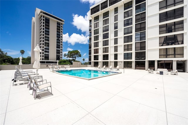 view of pool featuring a patio area