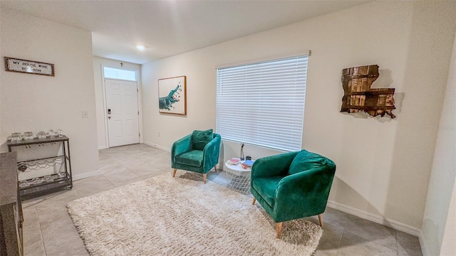 living area with light tile patterned floors