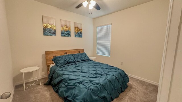 carpeted bedroom featuring ceiling fan