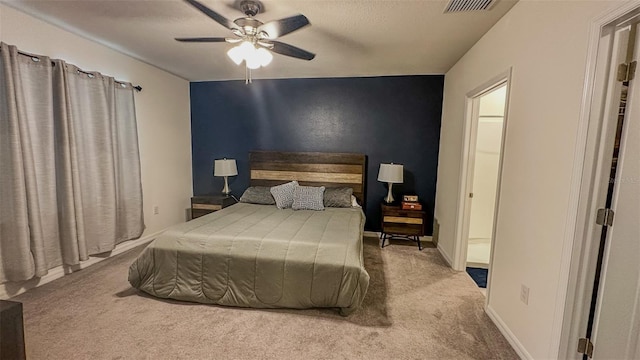 bedroom with light carpet and ceiling fan