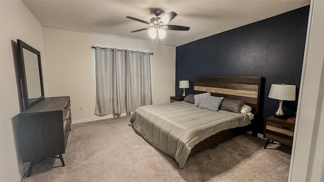 bedroom with light colored carpet and ceiling fan