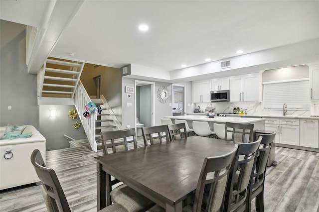 dining area with light hardwood / wood-style floors