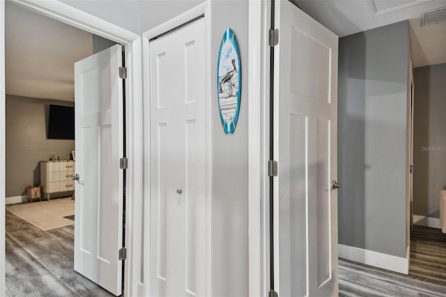 hallway featuring hardwood / wood-style flooring