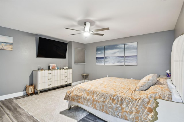 bedroom with wood-type flooring and ceiling fan