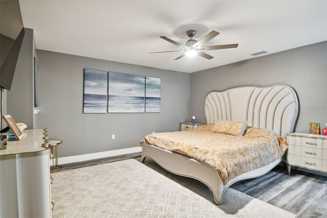 bedroom featuring hardwood / wood-style flooring and ceiling fan