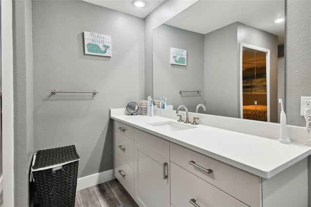 bathroom featuring wood-type flooring and vanity