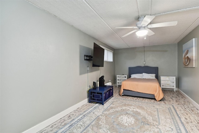 bedroom featuring a textured ceiling and ceiling fan