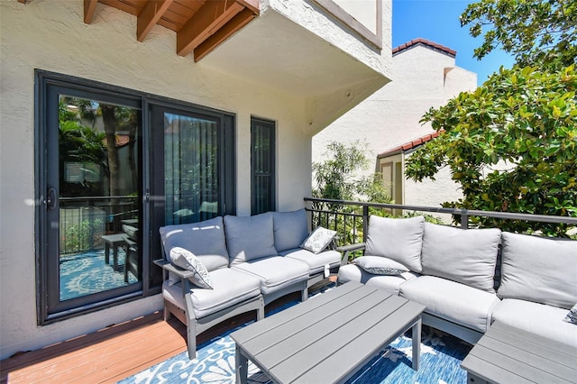 deck featuring outdoor lounge area