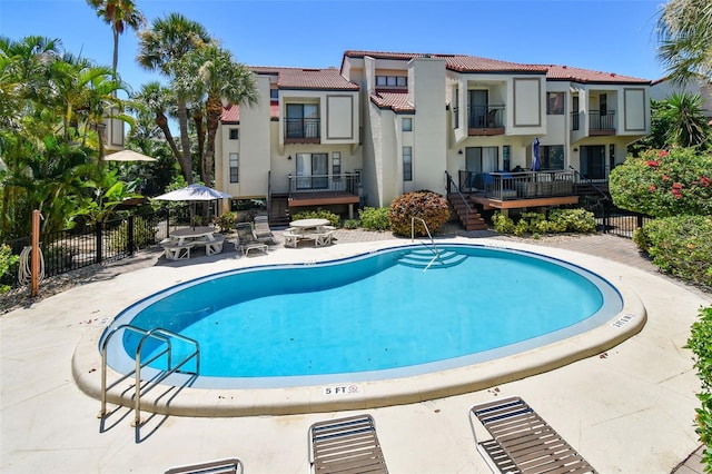 view of swimming pool with a patio area