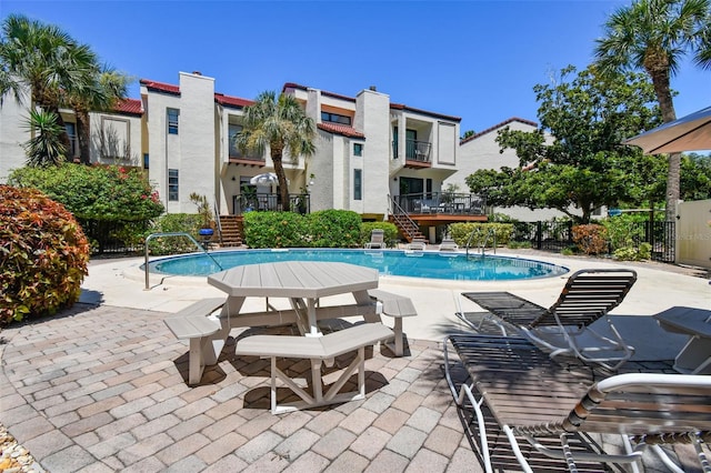 view of pool featuring a patio area