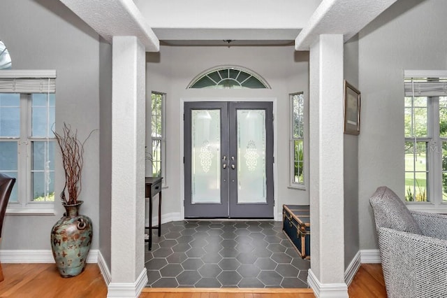 entryway featuring french doors and hardwood / wood-style floors