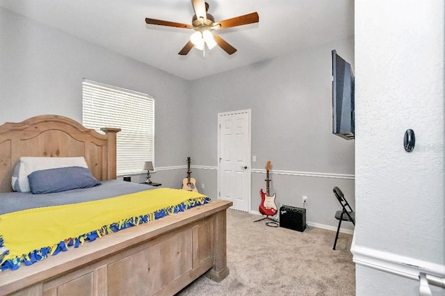 bedroom featuring light colored carpet and ceiling fan