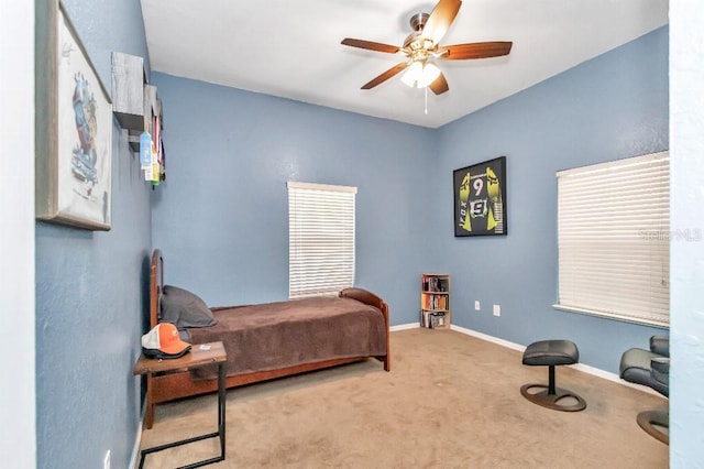 carpeted bedroom with ceiling fan