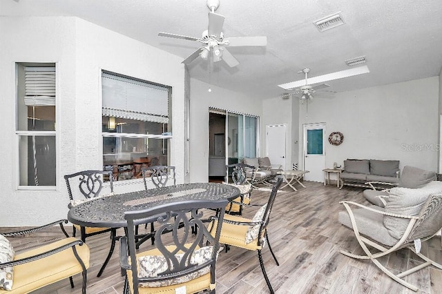 sunroom / solarium with ceiling fan