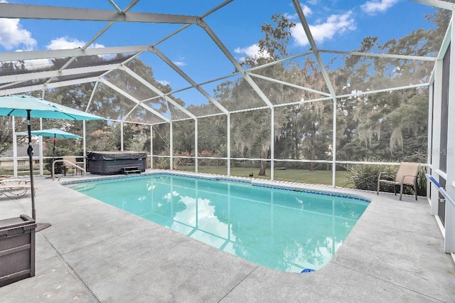 view of pool featuring a patio, a lanai, and a hot tub