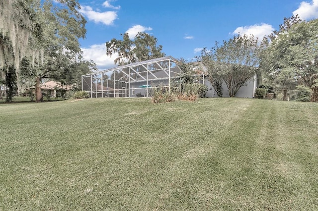 view of yard featuring a lanai