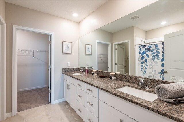 bathroom with vanity, tile patterned floors, and a shower with shower curtain