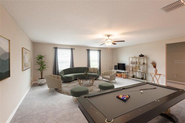 game room with ceiling fan, billiards, a textured ceiling, and carpet