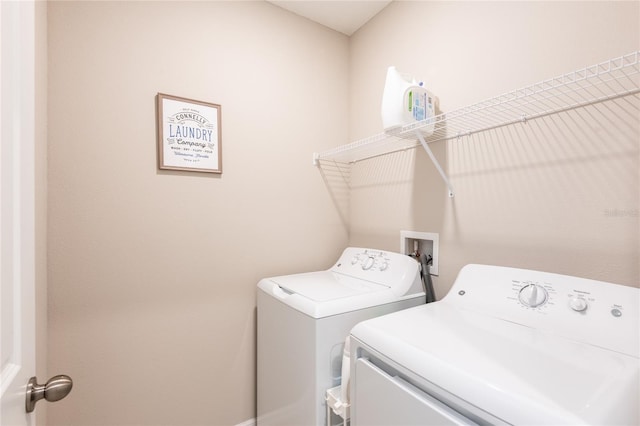 laundry area with washer and clothes dryer