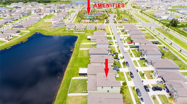 birds eye view of property featuring a water view