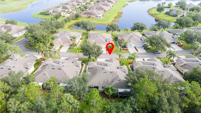 birds eye view of property featuring a water view