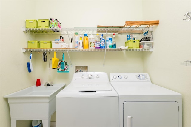 laundry room with sink and washing machine and dryer