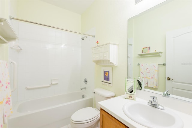 full bathroom with vanity, toilet, and tiled shower / bath combo