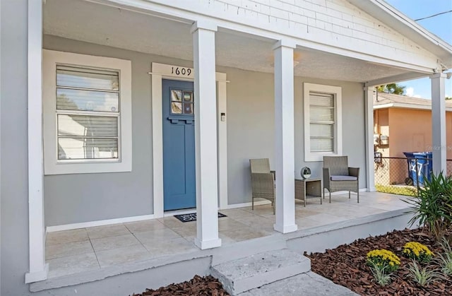 property entrance with covered porch