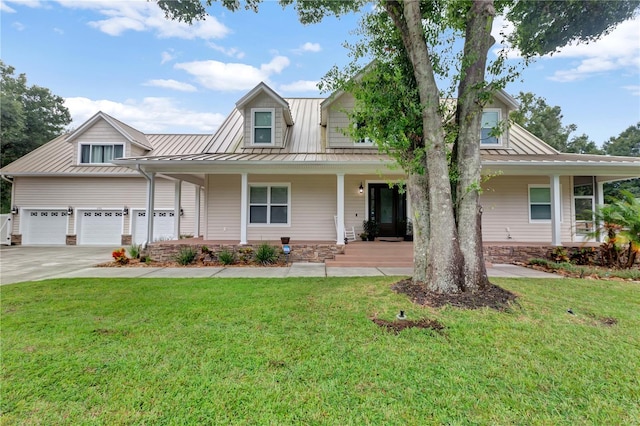 view of front facade featuring a garage, covered porch, and a front lawn